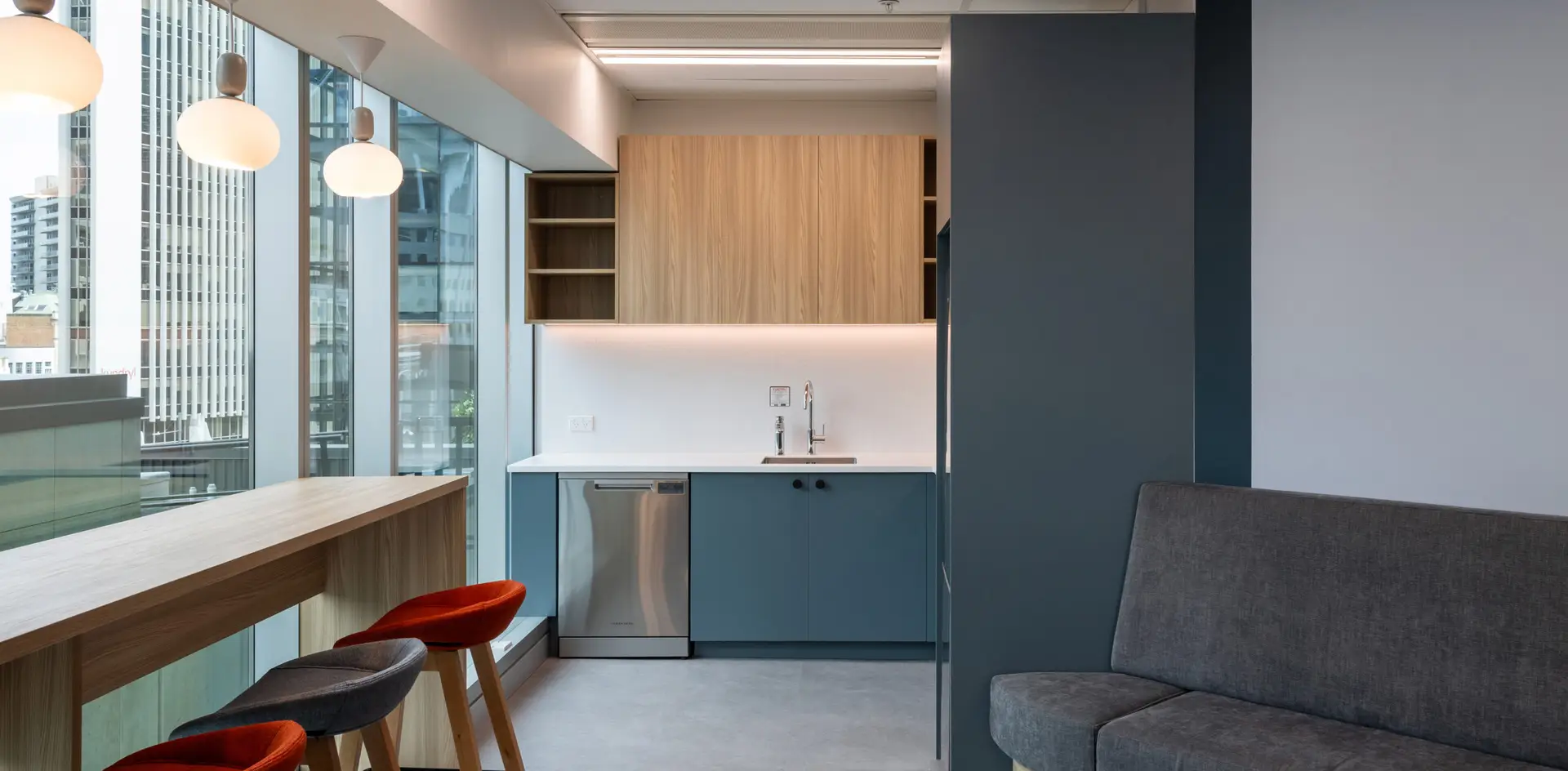 Hewlett Packard Enterprise kitchen island with bar stools and pendant lighting
