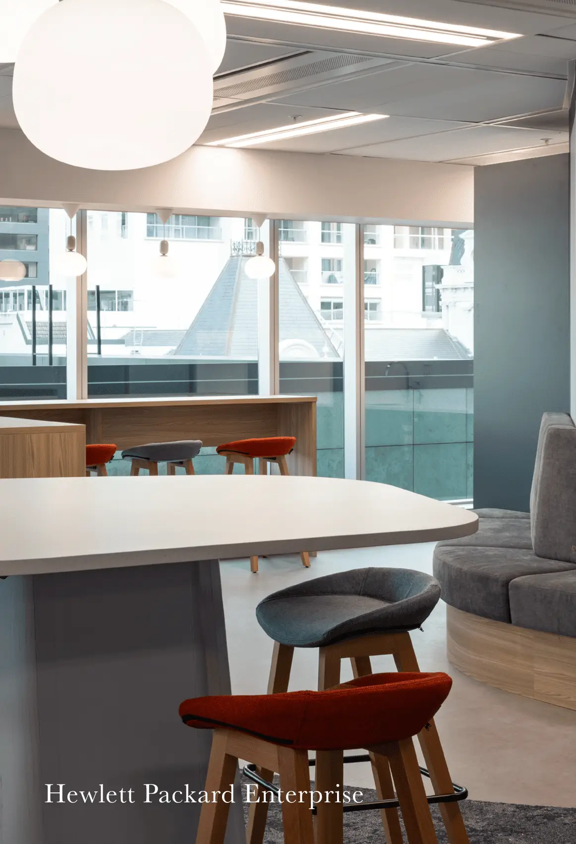 Hewlett Packard Enterprise Auckland office with kitchen, seating, and city view