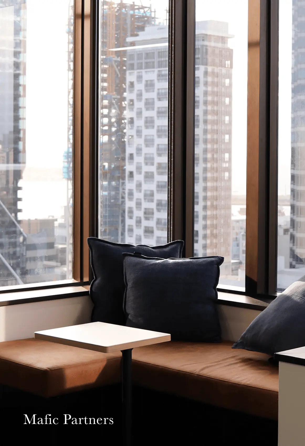 Mafic Partners boardroom with timber finishes and pendant lighting