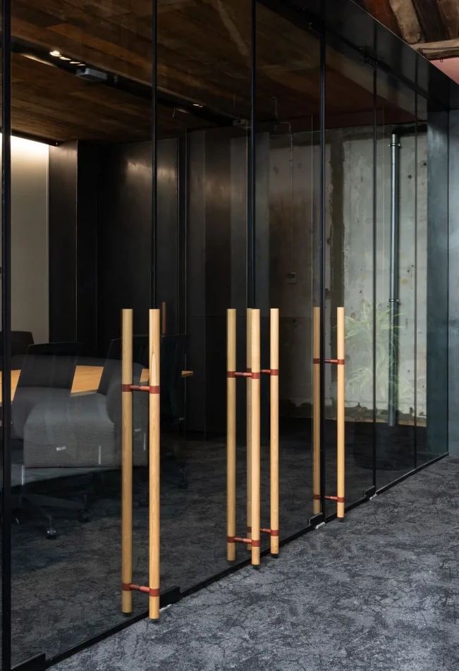 Cube Credit boardroom area with glass walls and exposed timber beams
