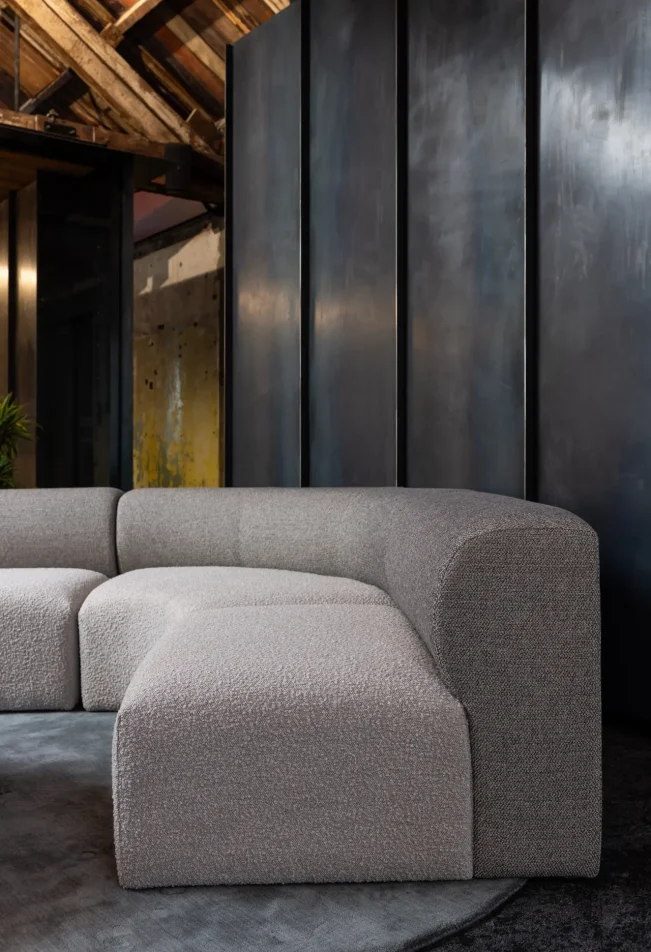 Casual lounge with soft seating and integrated shelving