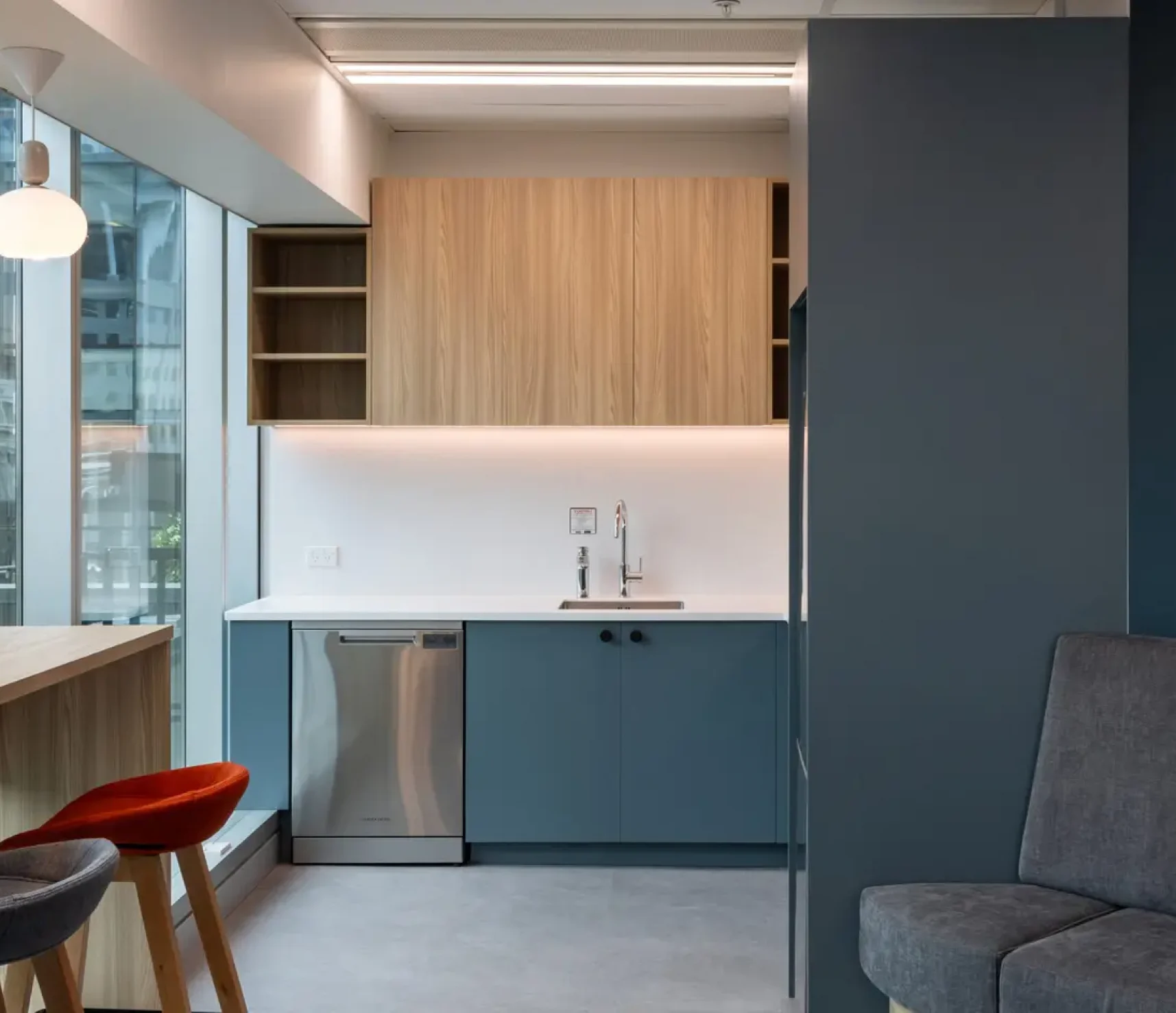 Hewlett Packard Enterprise kitchen island with bar stools and pendant lighting