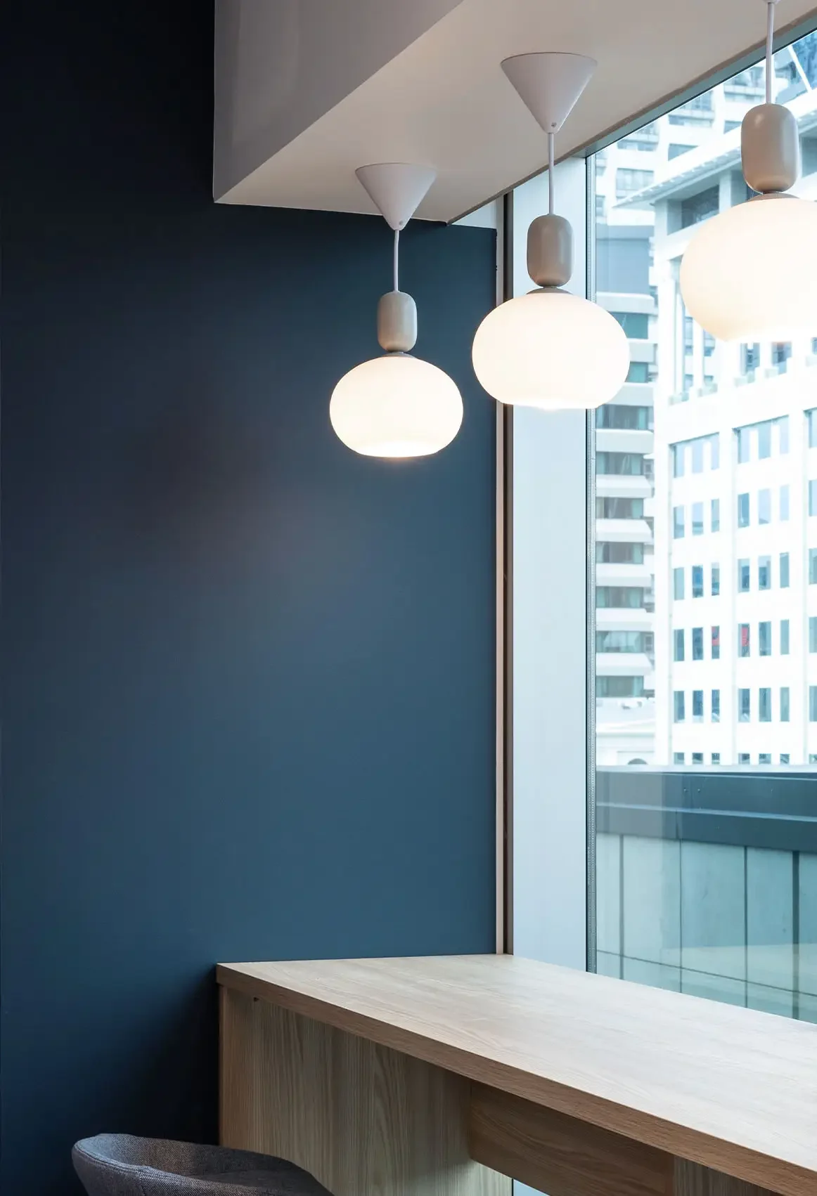 Hewlett Packard Enterprise kitchen island with bar stools and pendant lights