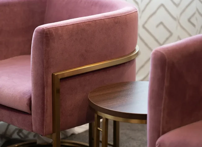 Pair of pink chairs in TRYP Wellington hotel room