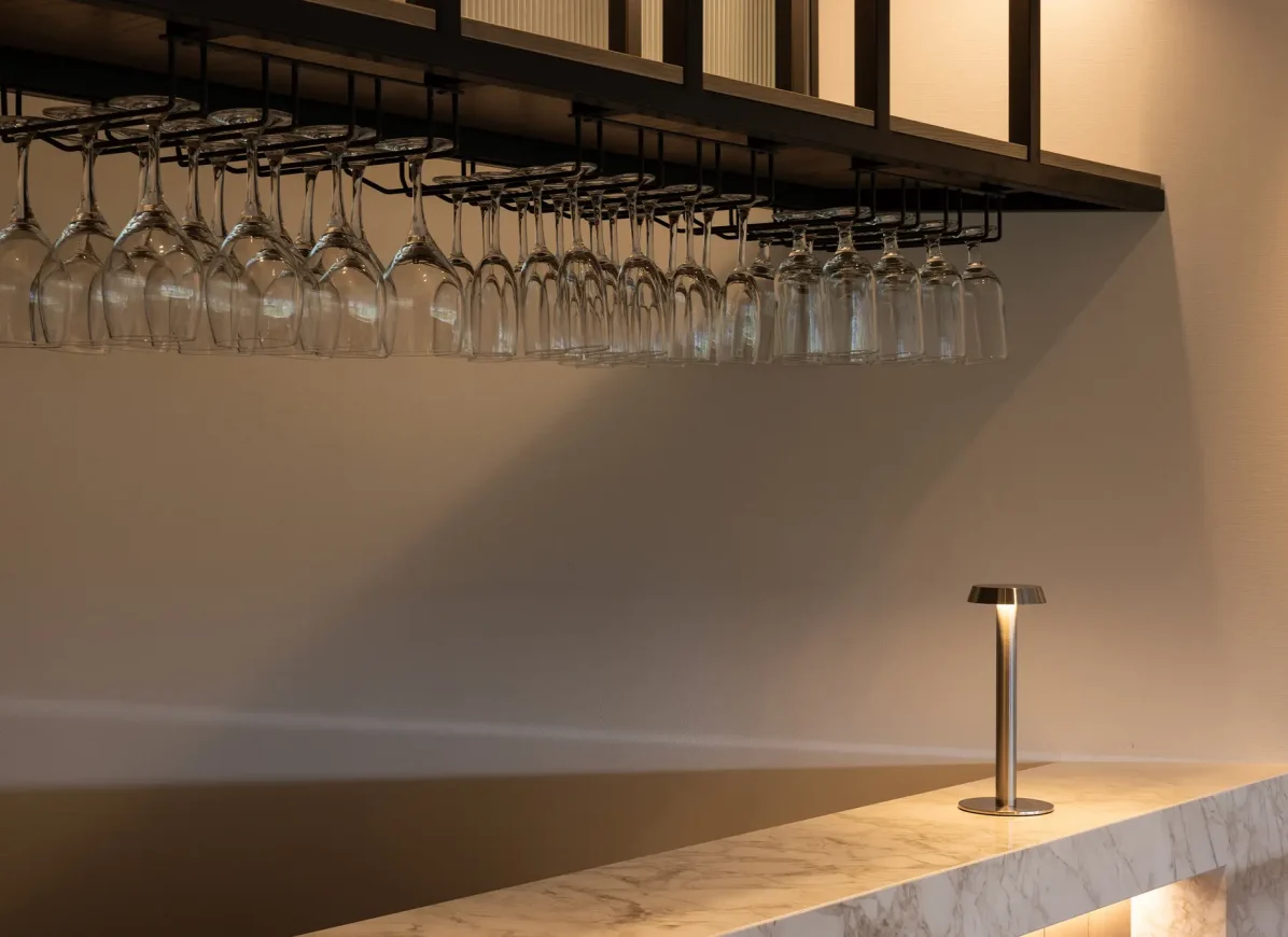 Bar area in Cambridge Suite with hanging wine glasses and timber shelving
