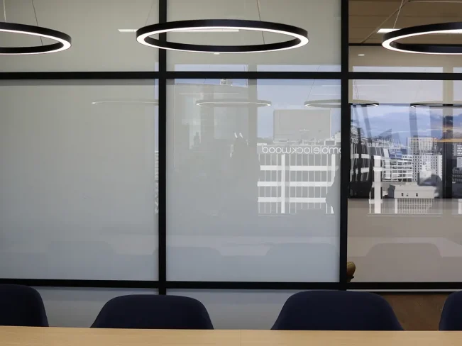 Boardroom with round pendant lights and central table