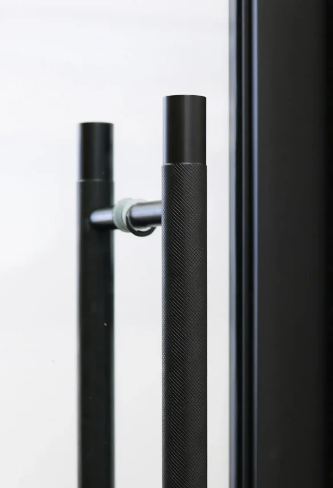 Close-up of door handle on timber sliding privacy panel