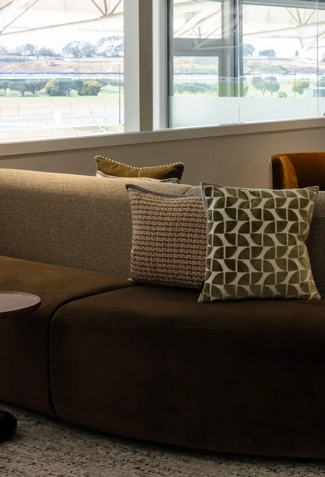 Curved lounge seating in Cambridge Suite with ambient lighting