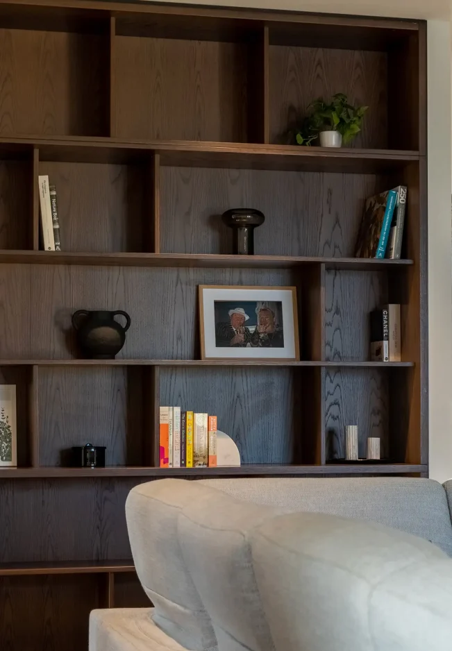 Dark oak shelving unit in TRYP Penthouse interior