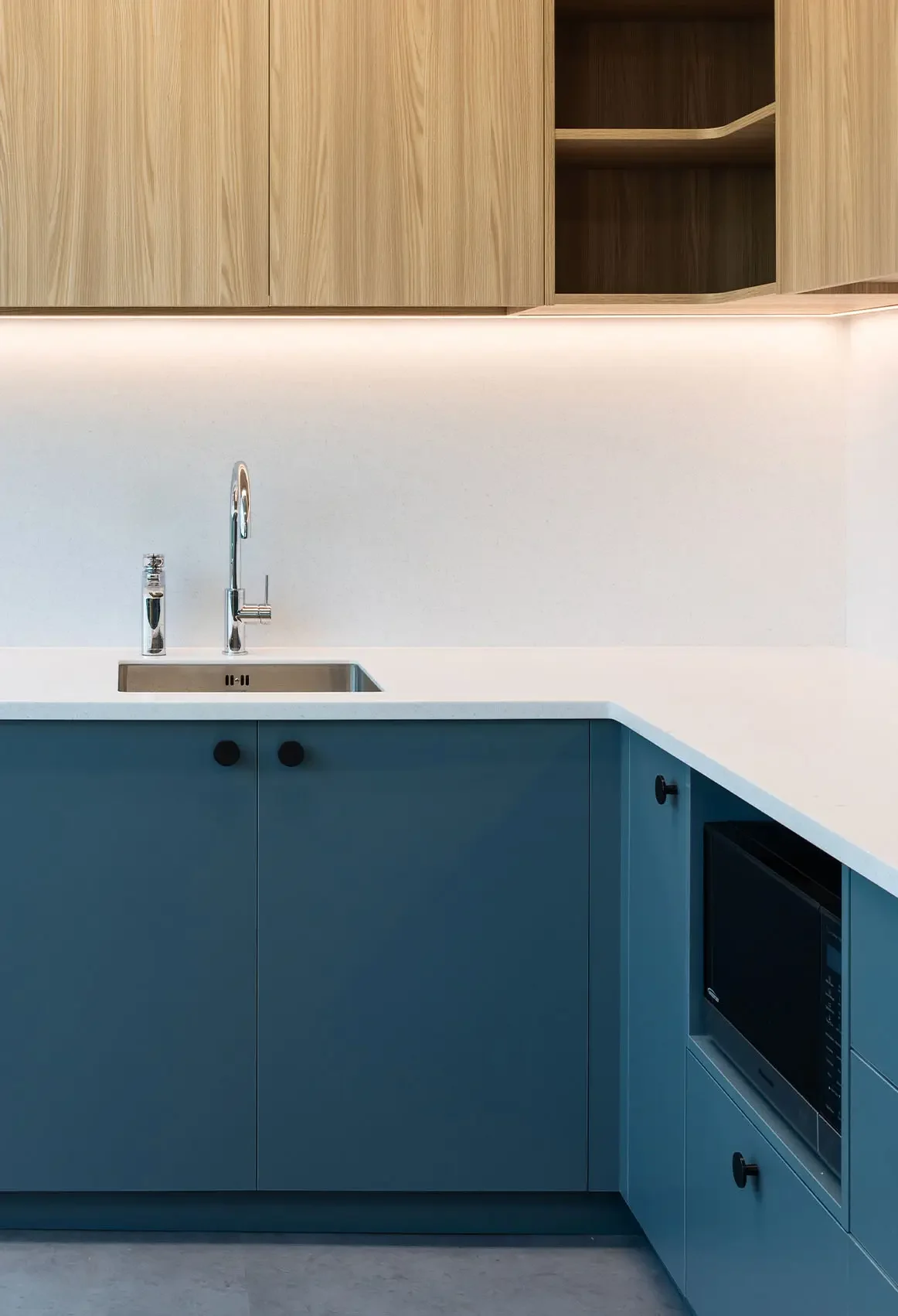 Hewlett Packard Enterprise kitchen area with modern cabinetry and integrated appliances